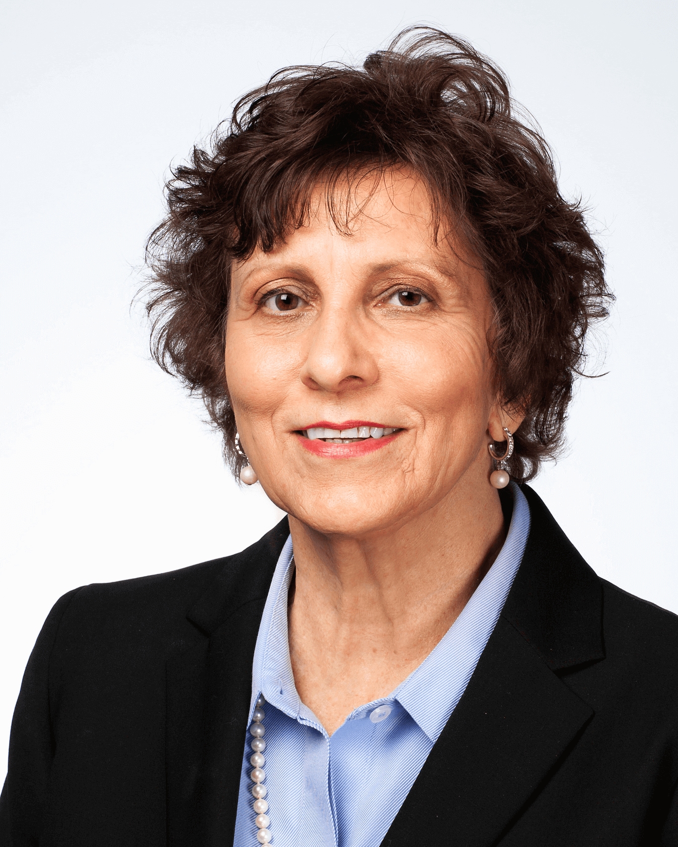Attorney Nancy Mizerak Headshot in front of books